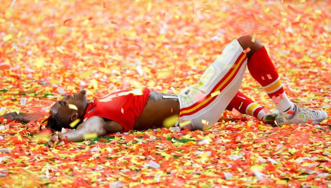 Demarcus Robinson of the Chiefs lays in confetti after winning the Super Bowl