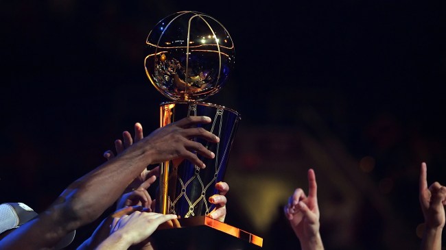 The Larry O'Brien trophy being raised following the NBA Finals